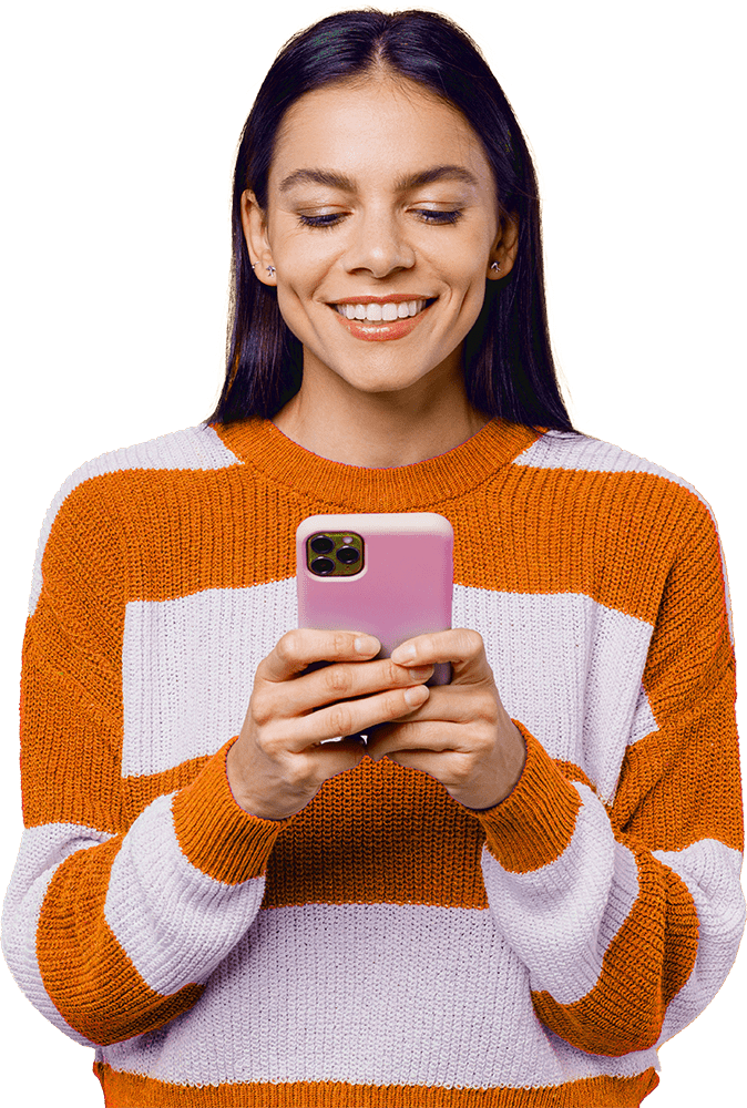 Woman in an orange sweater using phone