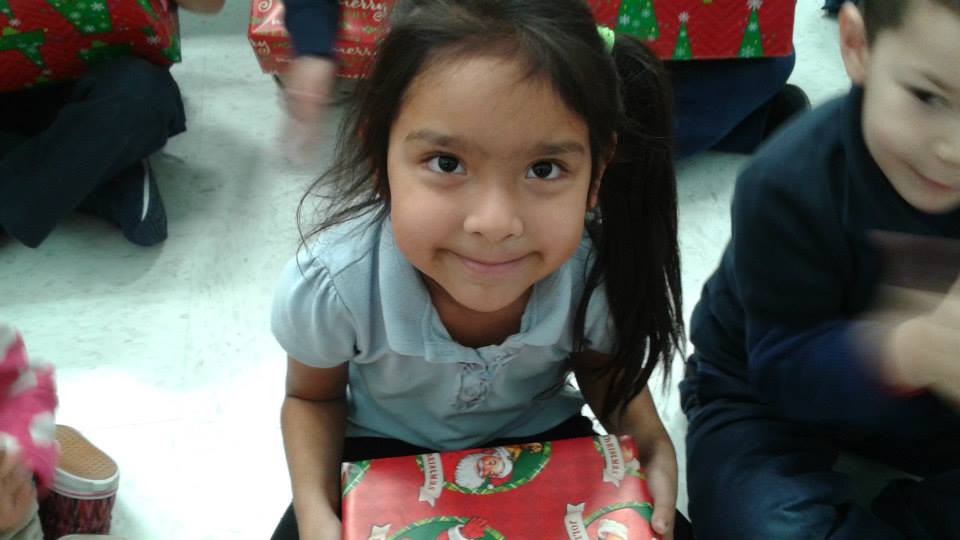 Child at Guadalupe School with New Shoes from Utah First and The Community Volunteers of Utah Warm the Soles